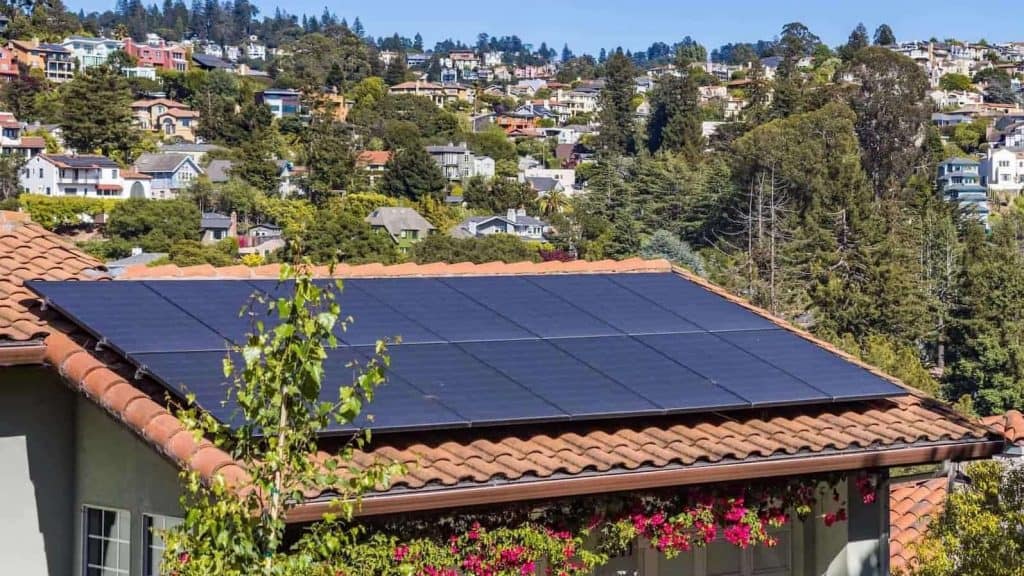 A House with Solar Panel on the Roof Hybrid Type Heat Pump